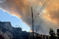 <p>Smoke from the Tantallon wildfire rises over houses in nearby Bedford, Nova Scotia, Canada, May 28, 2023. REUTERS/Eric Martyn</p> 