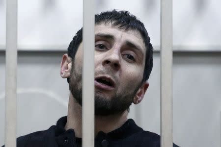 Zaur Dadayev, charged with involvement in the murder of Russian opposition figure Boris Nemtsov, speaks inside a defendants' cage inside a court building in Moscow, March 8, 2015. REUTERS/Tatyana Makeyeva