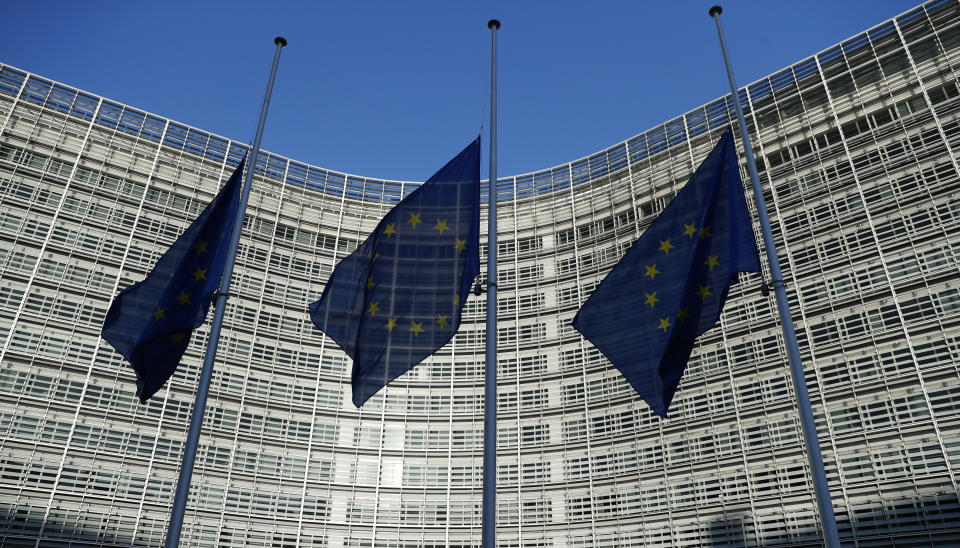 EU flags fly at half staff outside the headquarters of the EU in Brussels, Belgium, Wednesday, Dec., 12, 2018, in respect for the victims of the shooting attack at a Christmas market in Strasbourg, France, that happened Tuesday. An EU Summit will be held in Brussels starting Thursday. (AP Photo/Alastair Grant)