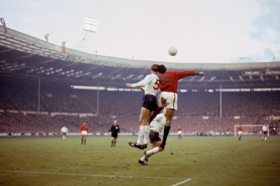 Jack Charlton, who was to develop dementia in later life, heads a ball for England (PA) (PA Archive)