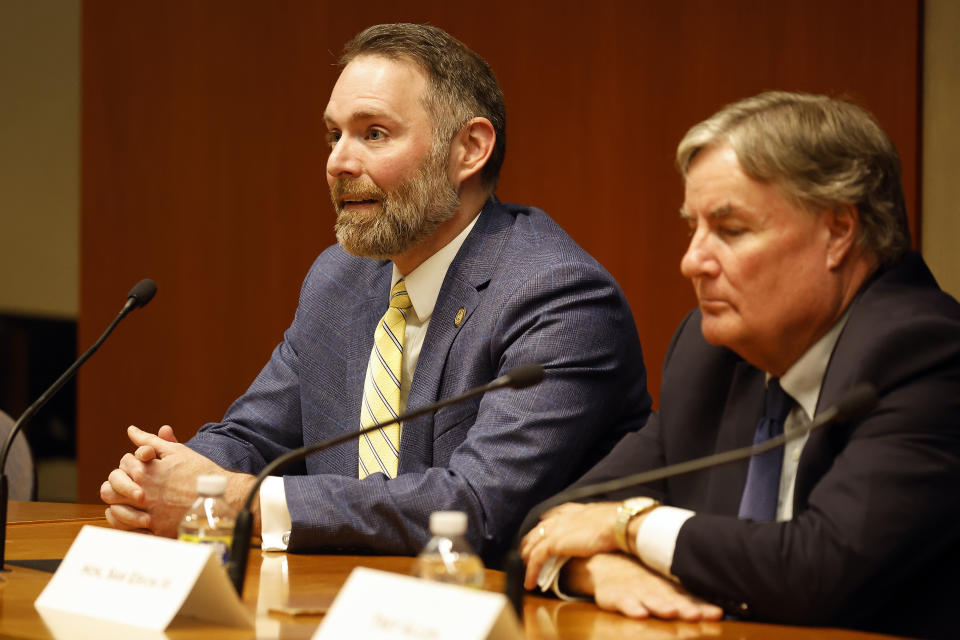 Court of Appeals Judge Richard Dietz, left, answers a question, with Supreme Court Associate Justice Sam Ervin IV, right, at the North Carolina Supreme Court Candidate Forum at Duke University Law School in Durham, N.C., Wednesday, Oct. 26, 2022. (AP Photo/Karl DeBlaker)