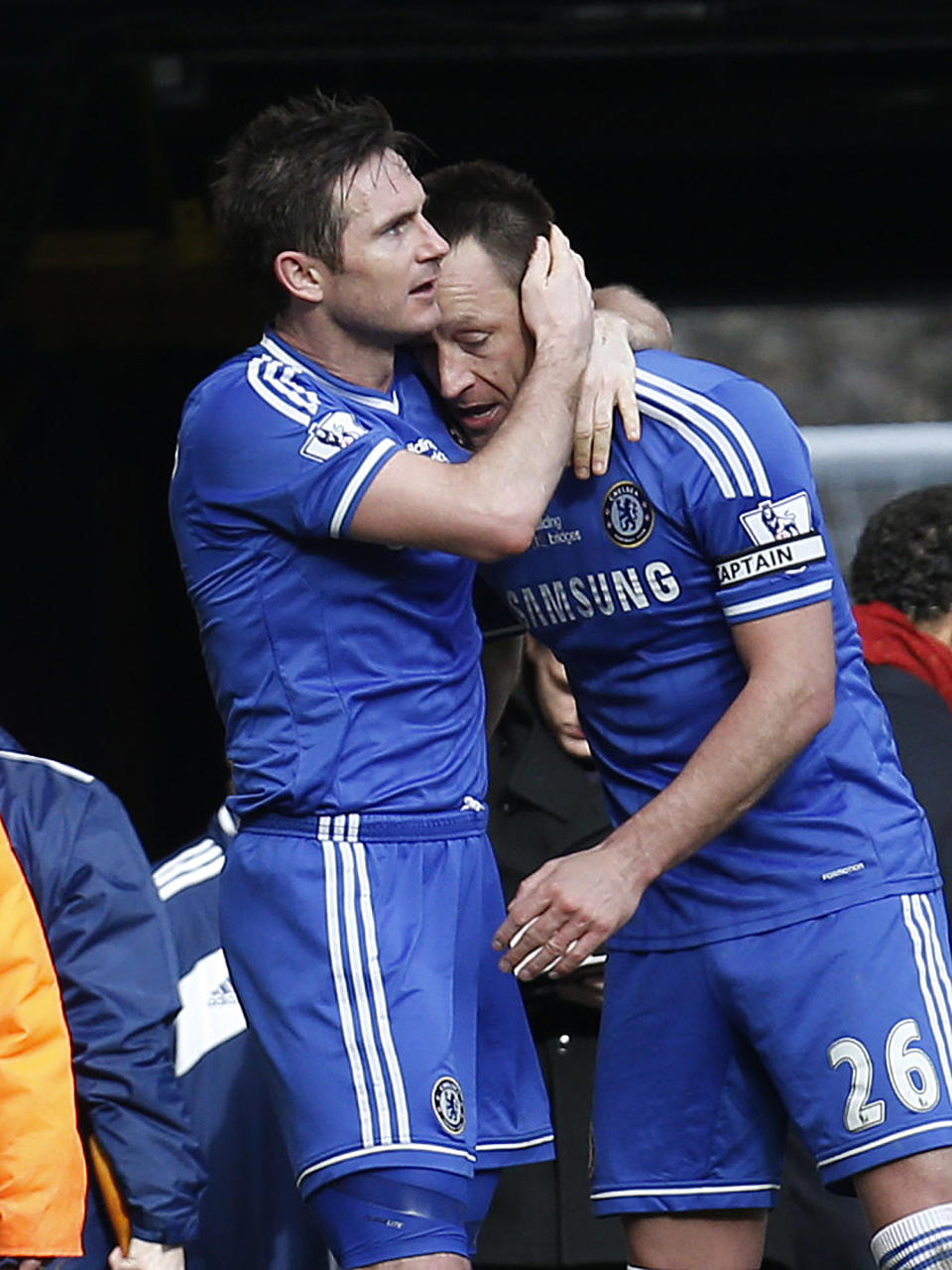 Chelsea's Frank Lampard, left, embraces his captain John Terry, after scoring against Everton during an English Premier League soccer match at the Stamford Bridge ground in London, Saturday, Feb. 22, 2014. Chelsea won the match 1-0. (AP Photo/Lefteris Pitarakis)