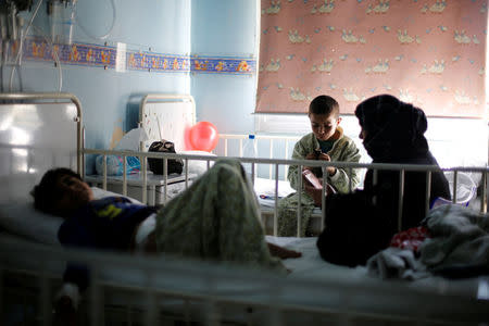 Children sit in beds as they receive treatment inside cancer ward of The Children's Hospital in Damascus, Syria February 20, 2017. Picture taken February 20, 2017. REUTERS/Omar Sanadiki