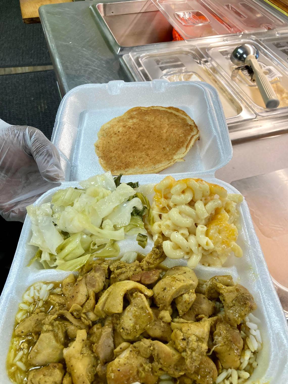 Chicken curry, mac and cheese, cabbage and hoe cake cornbread from Hunni BJ’s Foodbar, a new cafeteria-style Southern and Cajun food restaurant at 504 Russell Parkway in Warner Robins.
