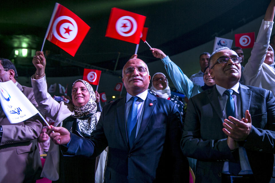 Supporters of Islamist party Ennahda attend the meeting with Vice President of the Islamist party Ennahda and candidate for the upcoming presidential elections Abdelfattah Mourou in Tunis, Tunisia, Friday, Aug. 30, 2019. (AP Photo/Hassene Dridi)