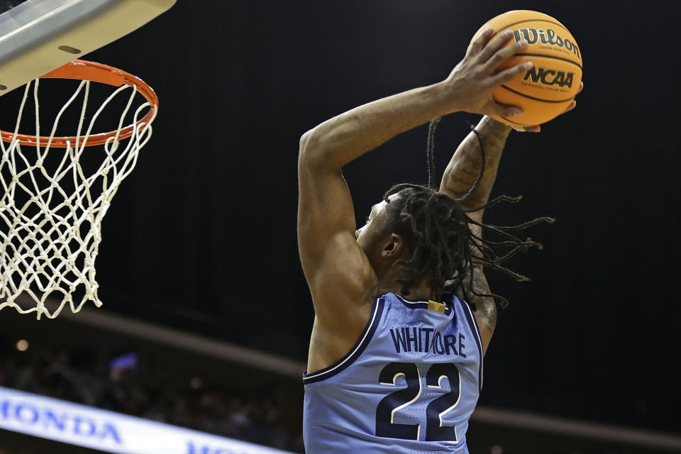 Villanova forward Cam Whitmore goes up to dunk against Boston College during the second half of an NCAA college basketball game Saturday, Dec. 10, 2022, in Newark, N.J. (AP Photo/Adam Hunger)