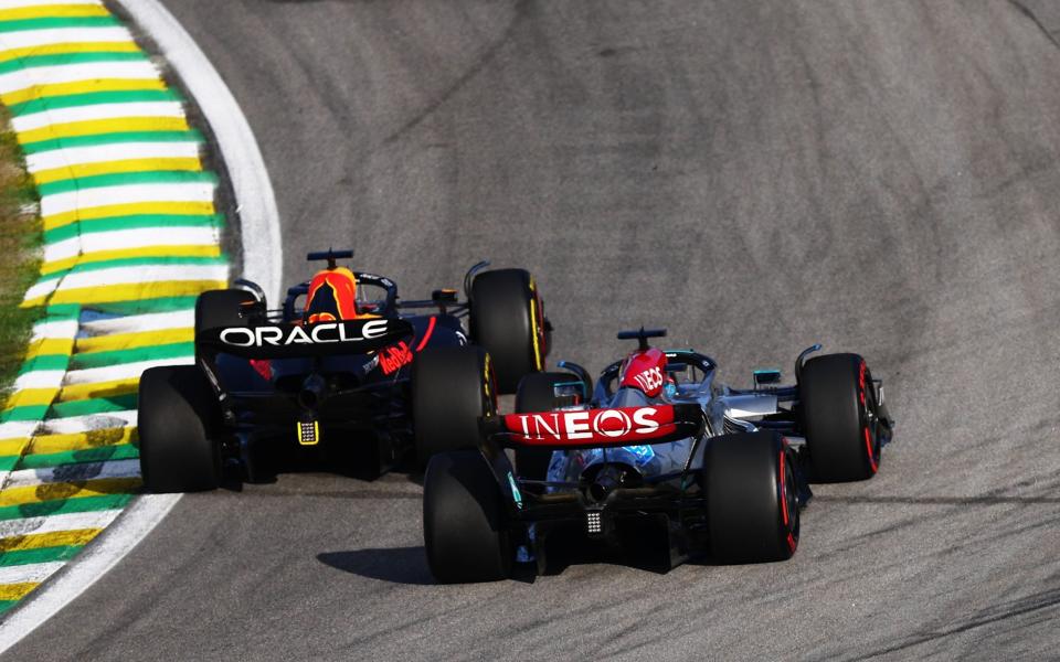 Max Verstappen of the Netherlands driving the (1) Oracle Red Bull Racing RB18 leads George Russell of Great Britain driving the (63) Mercedes AMG Petronas F1 Team W13 during the Sprint ahead of the F1 Grand Prix of Brazil at Autodromo Jose Carlos Pace on November 12, 2022 in Sao Paulo, Brazil. - Mark Thompson/Getty Images