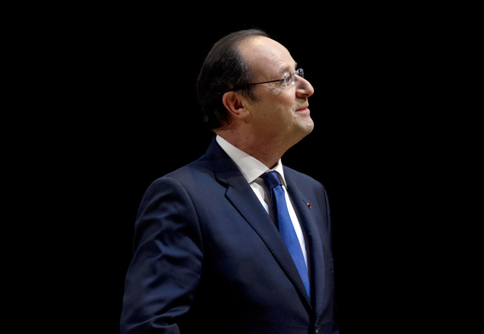 French President Francois Hollande visits the exhibition 'Birth of a Museum', at the Louvre museum, Tuesday April 29, 2014, in Paris. The 'Birth of a Museum' exposition presents paintings, sculptures, and other artworks that the famous French Louvre museum will send to the new Louvre museum branch in Abu Dhabi, in the United Arab Emirates, and which is expected to open in 2015. (AP Photo/Alain Jocard, Pool)