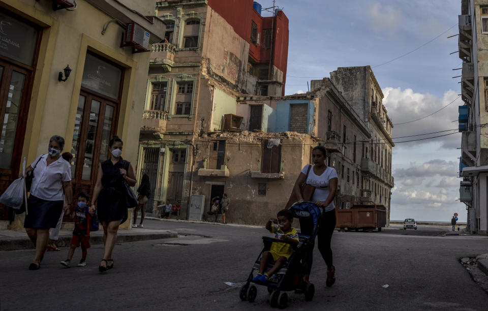 The roofless, top story of a home is exposed in Havana, Cuba, Wednesday, June 22, 2022. One of Cuba’s main social problems is a shortage of quality housing caused by decades of inadequate maintenance, a lack of new housing and impediments facing people trying to fix up their own homes. (AP Photo/Ramon Espinosa)