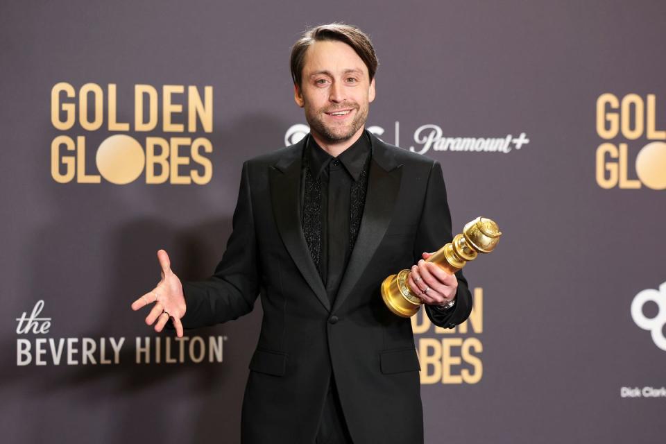 kieran culkin with his golden globe award for best actor in a tv series