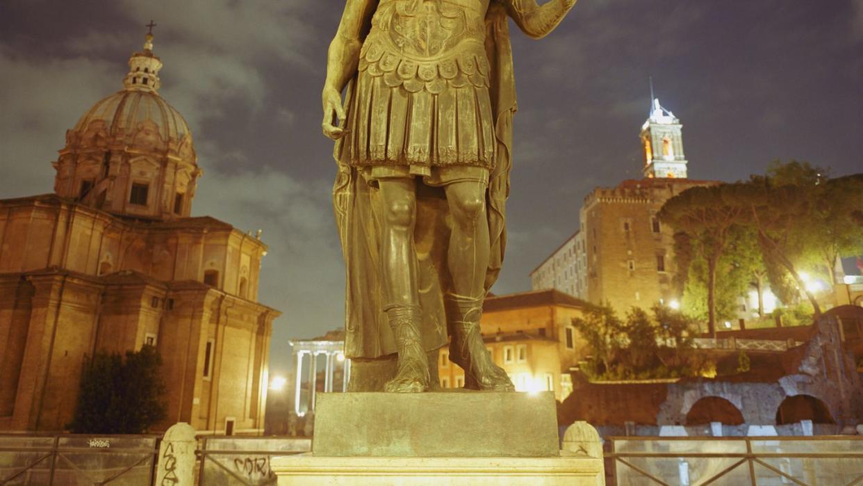 italy, rome, statue of caesar in front of roman forum