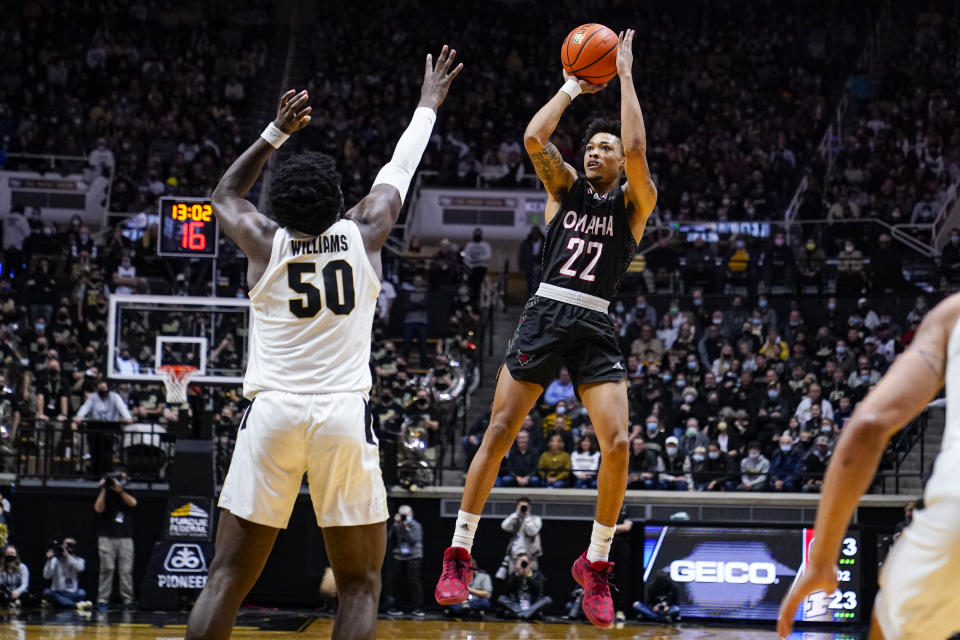 Omaha's Marco Smith (22) shoots over Purdue's Trevion Williams (50) during the first half of an NCAA college basketball game in West Lafayette, Ind., Friday, Nov. 26, 2021. (AP Photo/Michael Conroy)