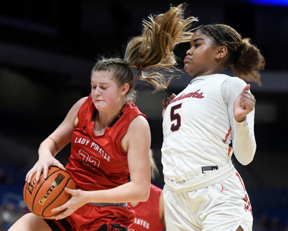 Lubbock-Cooper's Karlee Cronk, left, rebounds the ball against Liberty in the UIL Class 5A girls state championship basketball game, Saturday, March 4, 2023, at the Alamodome in San Antonio. 