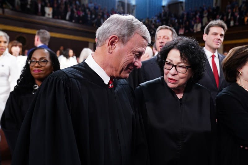 Chief Justice of the Supreme Court John Roberts chats with Associate Justice Sonia Sotomayor at the U.S. Capitol in Washington, D.C., on March 7. Roberts wrote the majority opinion in Monday's ruling on former President Donald Trump's immunity claim and Sotomayor wrote the dissenting opinion. File Pool photo by Shawn Thew/UPI