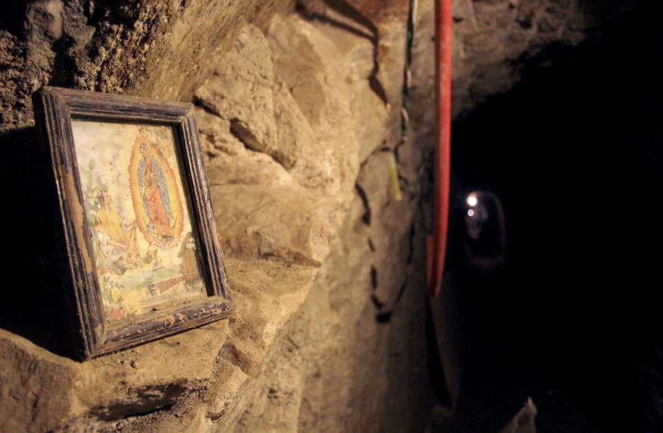 An image of the Virgin of Guadalupe is seen in a tunnel, nearly a mile (1.6 km) long running into California from Tecate near the Pacific coast, December 4, 2007, after it was discovered on Monday by law enforcement agencies. Gunmen killed the police chief of Tecate, a Mexican city bordering California, on Tuesday by shooting him some 50 times in an apparent revenge attack after police found the drug-smuggling tunnel under the border. REUTERS/Jorge Duenes