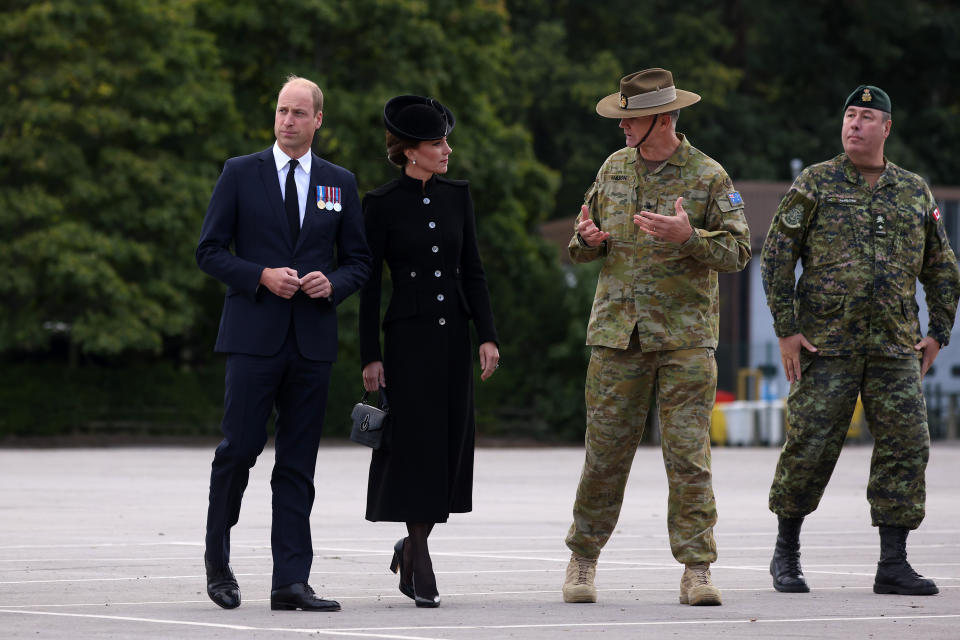 William and Kate meet with military personnel during a visit to Army Training Centre Pirbright on September 16, 2022 in Guildford, England. The Prince and Princess of Wales are visiting the training centre to meet troops from the Commonwealth who have been deployed to the UK in order to take part in the funeral of Queen Elizabeth II,which will take place on September 19. (Photo by Dan Kitwood/Getty Images)