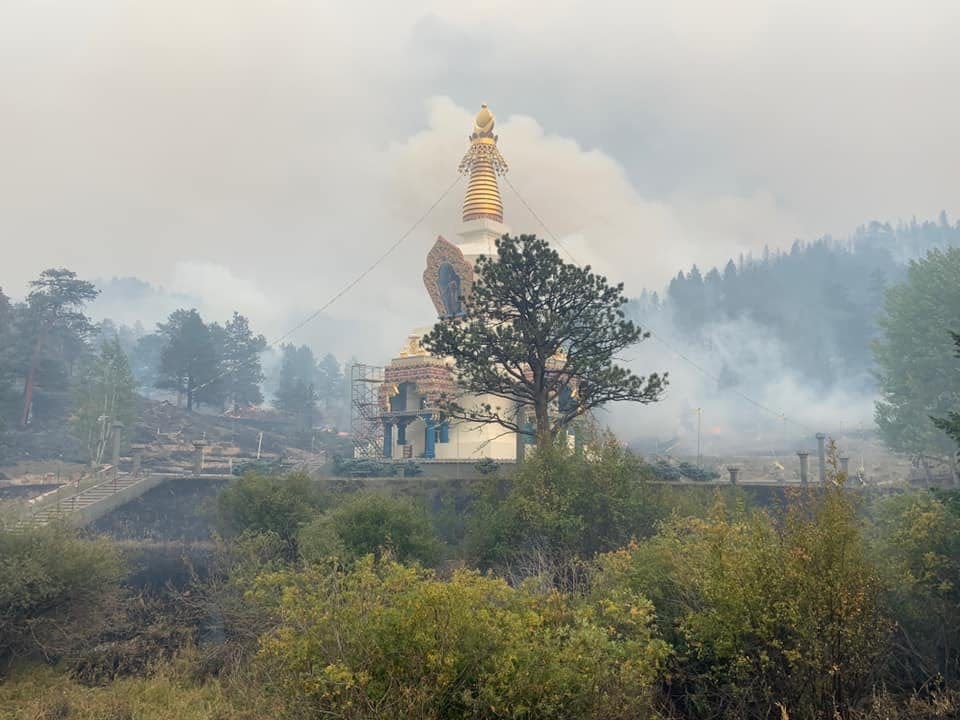 This photo shows the Shambhala Mountain Center's Stupa surrounded by smoke but unharmed after the Cameron Peak Fire burned through the 600-acre property south of Red Feather Lakes on Sept. 26, 2020.