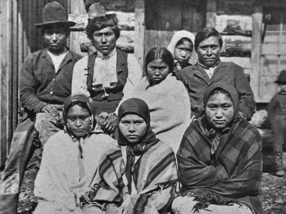 Stereoscopic image showing a group portrait of northwestern Native American Alaskans, Alaska, circa 1880. The image is one half of a stereoscopic image.