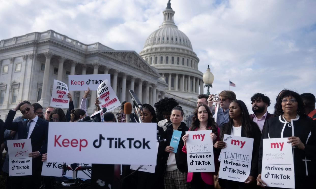 <span>People gather for a press conference about their opposition to a TikTok ban on Capitol Hill in Washington, DC on 22 March 2023.</span><span>Photograph: Brendan Smialowski/AFP/Getty Images</span>