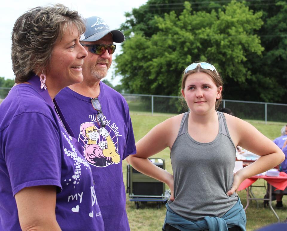 Michelle Ackerman, cancer survivor, with her husband Art, and daughter Maddy, encourage others in the battle.