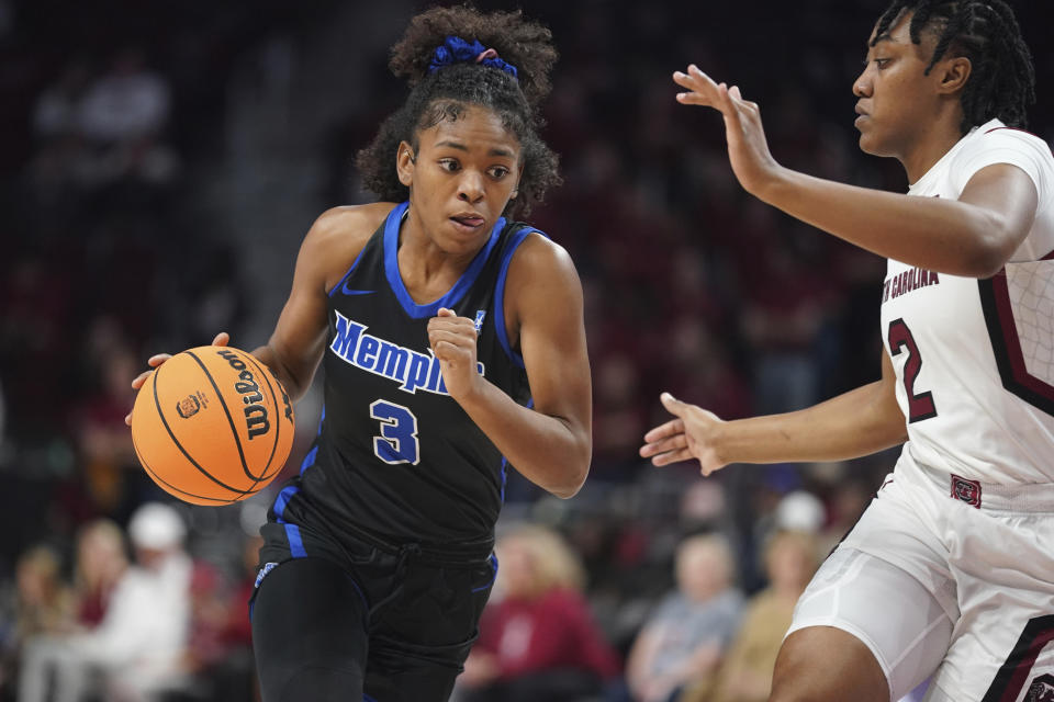 Memphis forward Shelbee Brown (3) dribbles the ball against South Carolina forward Ashlyn Watkins (2) during the first half of an NCAA college basketball game Saturday, Dec. 3, 2022, in Columbia, S.C. (AP Photo/Sean Rayford)