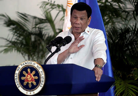 FILE PHOTO: President Rodrigo Duterte speaks after his arrival, from a visit in Israel and Jordan at Davao International airport in Davao City in southern Philippines, September 8, 2018. REUTERS/Lean Daval Jr/File Photo