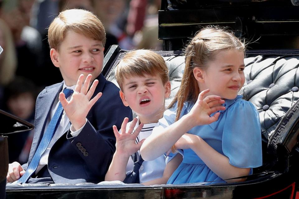 PHOTO: Prince George, Prince Louis and Princess Charlotte ride in a carriage as they attend the celebration of Britain's Queen Elizabeth's Platinum Jubilee, in London, June 2, 2022. (Peter Nicholls/Reuters)