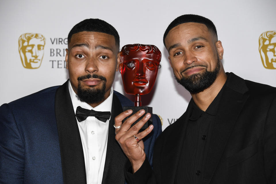 Jordan Banjo, left, and Ashley Banjo pose for photographers with their Must See Moment award in 'Britain's Got Talent' backstage at the British Academy Television Awards in London, Sunday, June 6, 2021. (AP Photo/Alberto Pezzali)