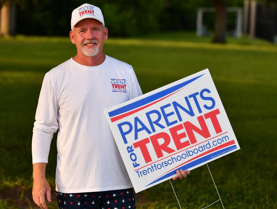 Brevard School Board candidate Gene Trent campaigns at Kiwanis Island on Tuesday before his election victory.