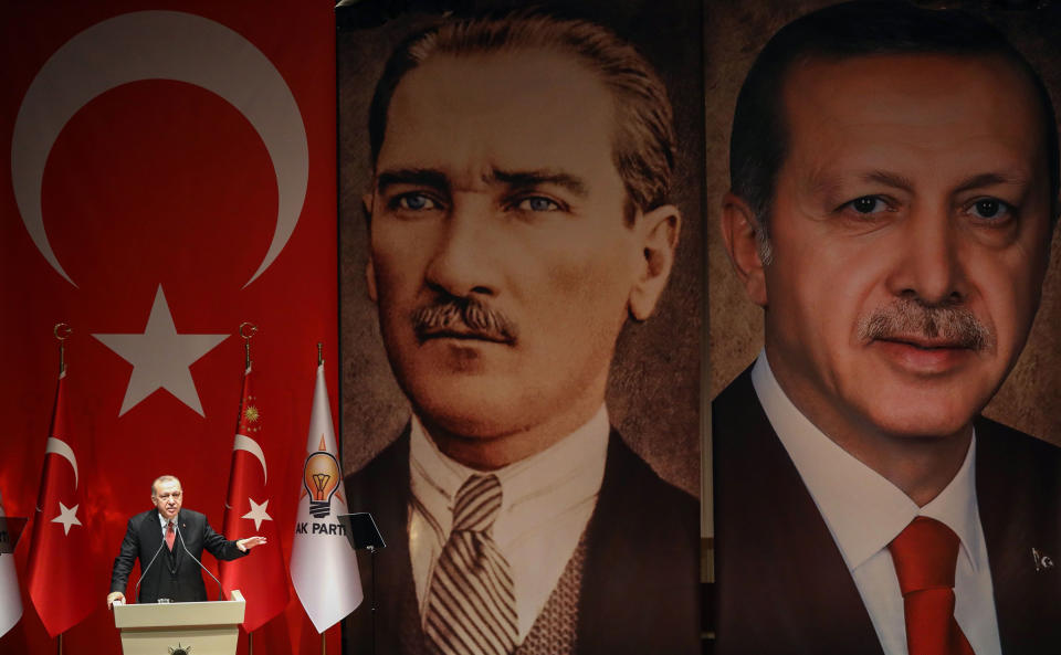 Turkish President Recep Tayyip Erdogan addresses a meeting of election officials in front of portraits of himself and Mustafa Kemal Ataturk, the founder of modern Turkey, in Ankara on Jan. 29, 2019.<span class="copyright">Adem Altan— AFP/Getty Images</span>