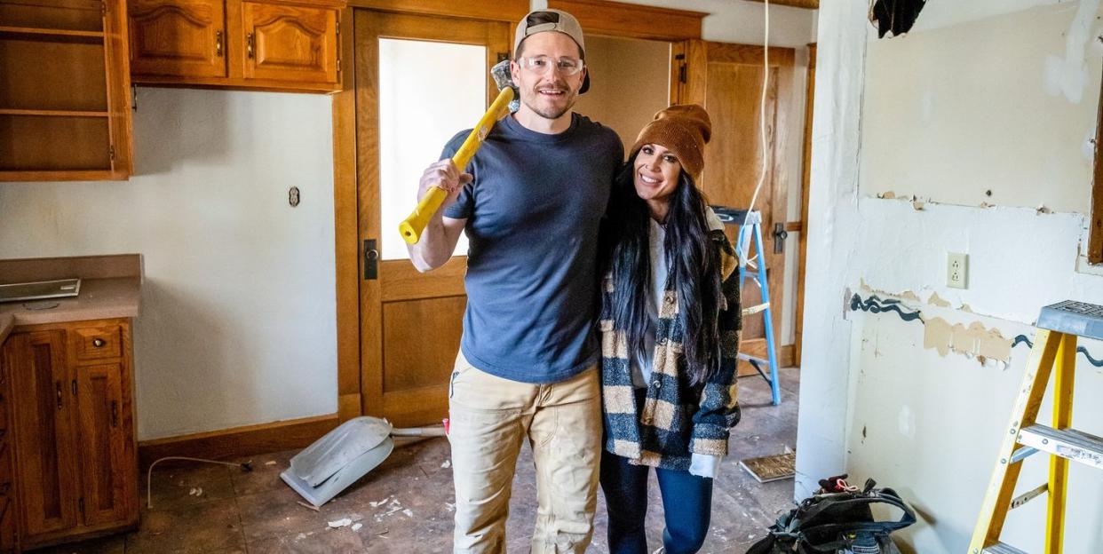 man and woman renovating house