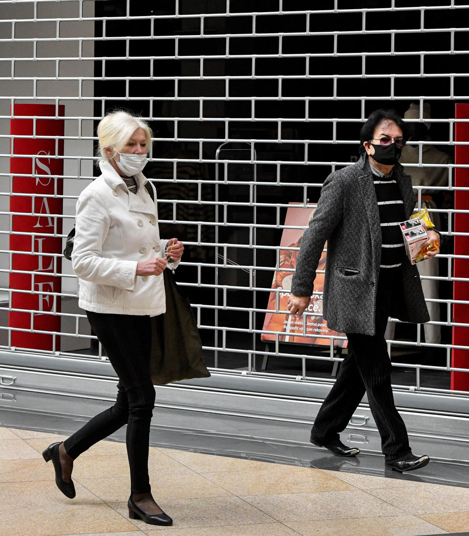Shoppers walk in front of a closed store in the Czech Republic. Source: AP