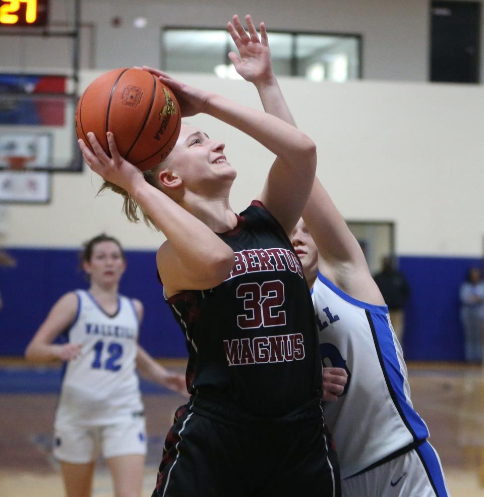 Albertus's Allie Falesto goes for a shot against Wallkill's Emma Dilemme during the New York State Class AA regional girls basketball final versus Wallkill on March 8, 2024.