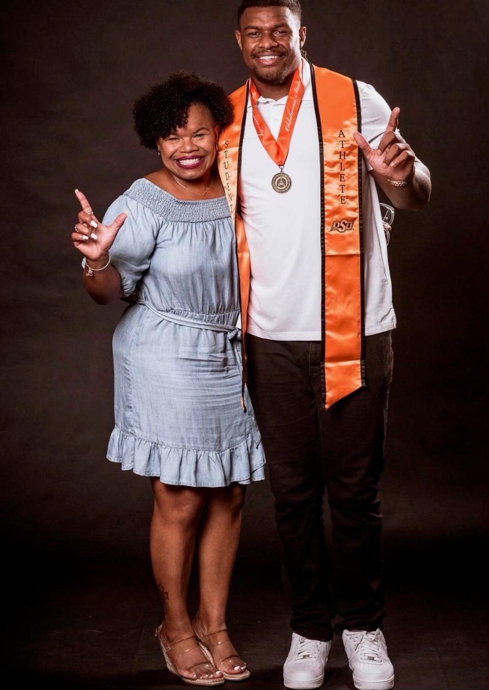 Jacksonville Jaguars defensive tackle Tyler Lacy with mother Veronica celebrate his graduation from Oklahoma State.