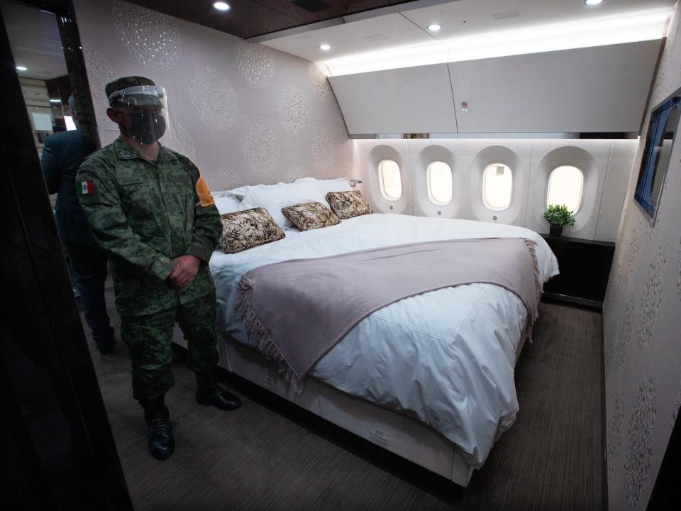 The private suite with a guard standing next to a king-sized bed onboard the former Mexican VIP Boeing 787.