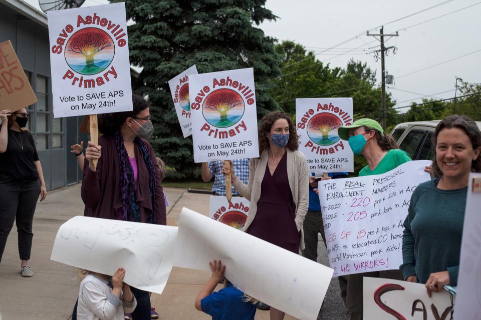 Outside a Asheville City Schools Board of Education’s specially called work session, more than 25 parents, students and community members gathered to protest the potential closure of Asheville Primary School.