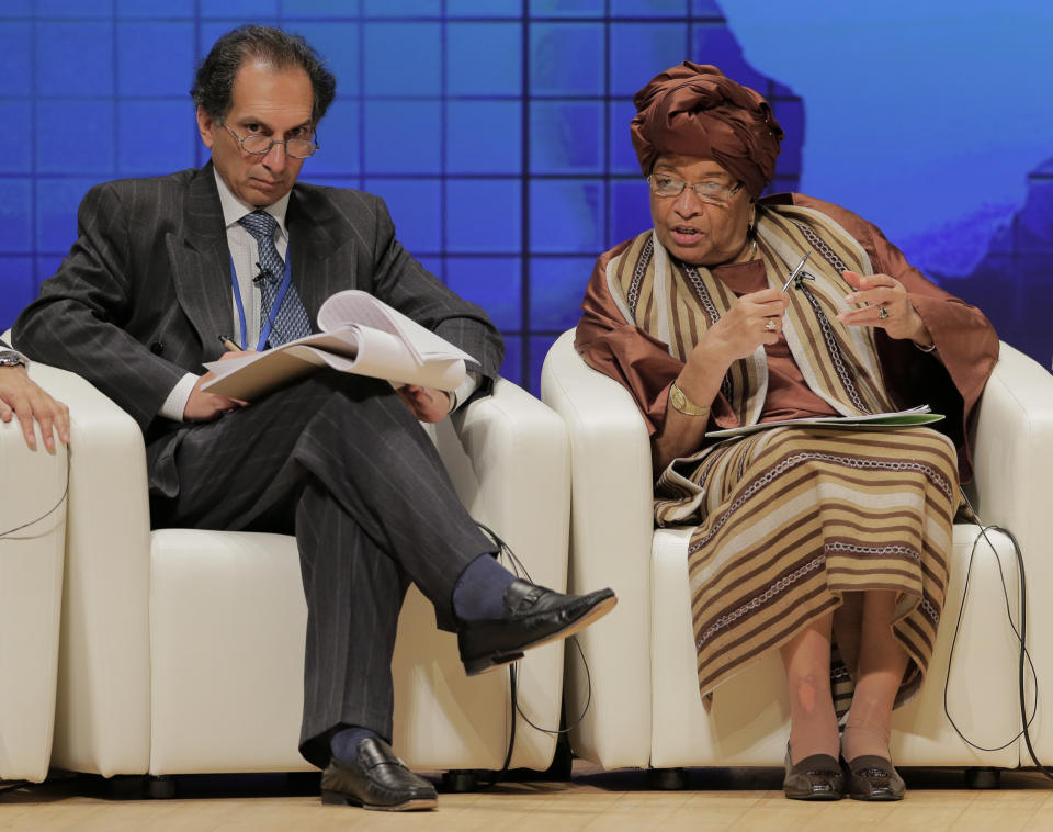 Liberia's President Ellen Johnson Sirleaf, right, speaks as Deputy Director in the Global Economy and Development Program Homi Kharas listens during a seminar at the IMF and World Bank annual meetings in Tokyo, Saturday, Oct. 13, 2012.(AP Photo/Itsuo Inouye)
