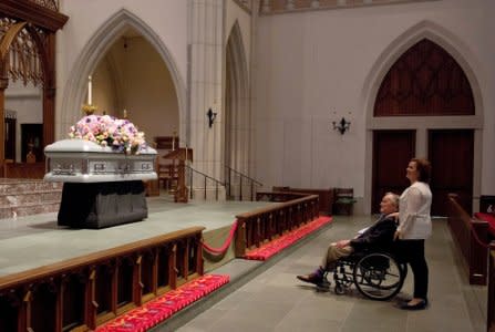 Former U.S. President George H. W. Bush looks at the casket of his late wife, former first lady Barbara Bush with his daughter Dorothy