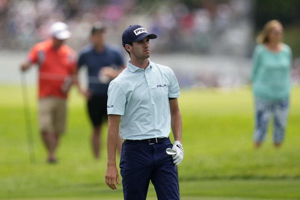 Alex Smalley watches his shot to the green on the 17th hole during the third round of the John Deere Classic golf tournament, Saturday, July 8, 2023, at TPC Deere Run in Silvis, Ill. (AP Photo/Charlie Neibergall)