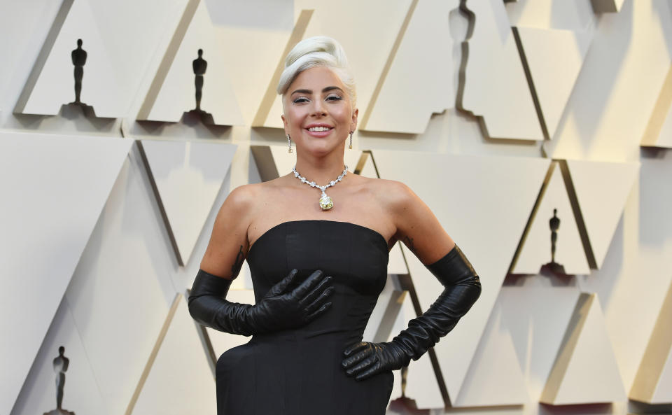 FILE - Lady Gaga arrives at the Oscars on Sunday, Feb. 24, 2019, in Los Angeles. The Academy of Motion Picture Arts and Sciences today announced shortlists in 10 categories for the 95th Academy Awards, including Lady Gaga for best original song for "Hold My Hand" from "Top Gun: Maverick" (Photo by Jordan Strauss/Invision/AP, File)