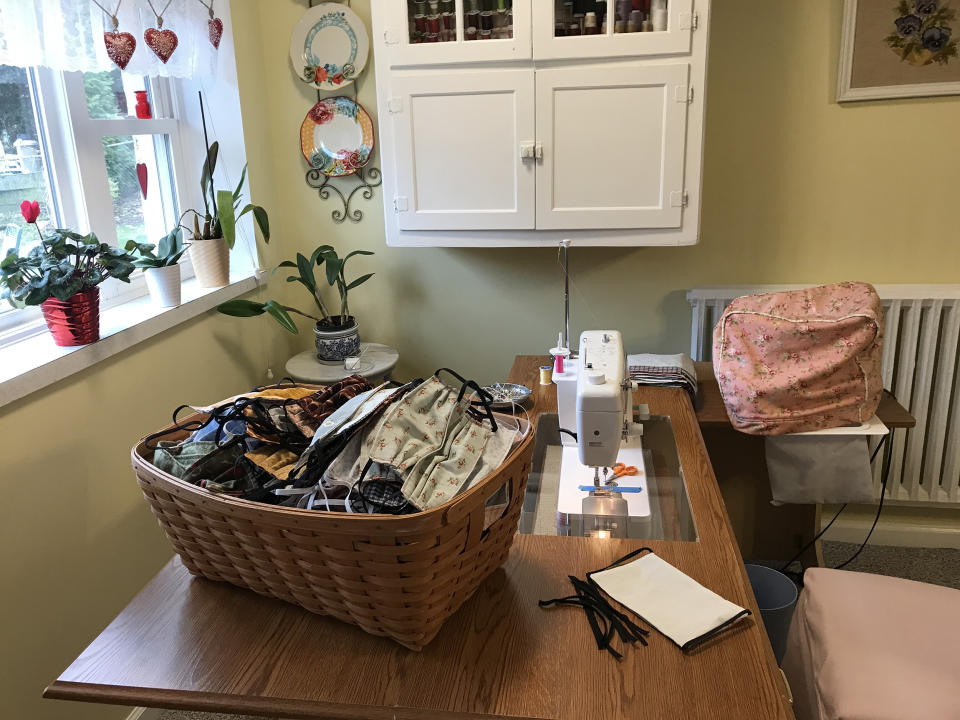 A basket of completed homemade face masks in Sheri Yeisley's workspace. (Courtesy of Sheri Yeisley)