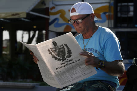 A Cuban reads the final draft proposal of changes to the constitution, in Havana, Cuba, January 8, 2019. Picture taken January 8, 2019. REUTERS/Stringer