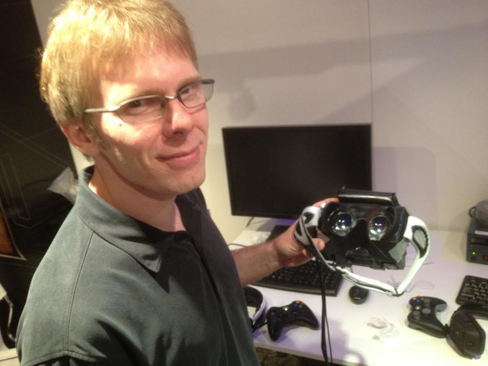Id Software co-founder, now Oculus CTO John Carmack shows off a virtual reality headset prototype at the Electronic Entertainment Expo in L.A. on June 5, 2012.