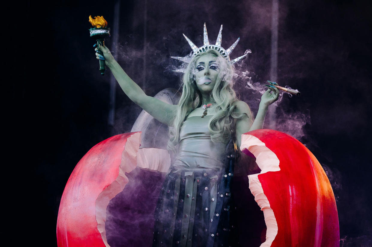 Chappell Roan dressed as lady liberty performing  (Nina Westervelt / Billboard via Getty Images)