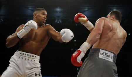 Britain Boxing - Anthony Joshua v Wladimir Klitschko IBF, IBO & WBA Super World Heavyweight Title's - Wembley Stadium, London, England - 29/4/17 Anthony Joshua in action with Wladimir Klitschko Action Images via Reuters / Andrew Couldridge Livepic