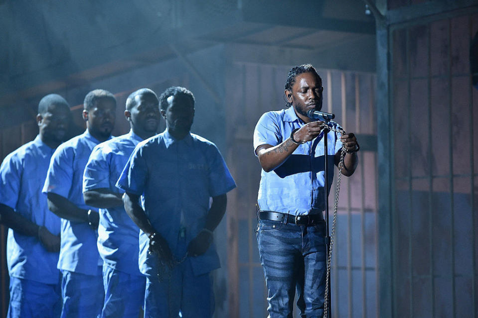 Kendrick Lamar onstage dressed as an inmate