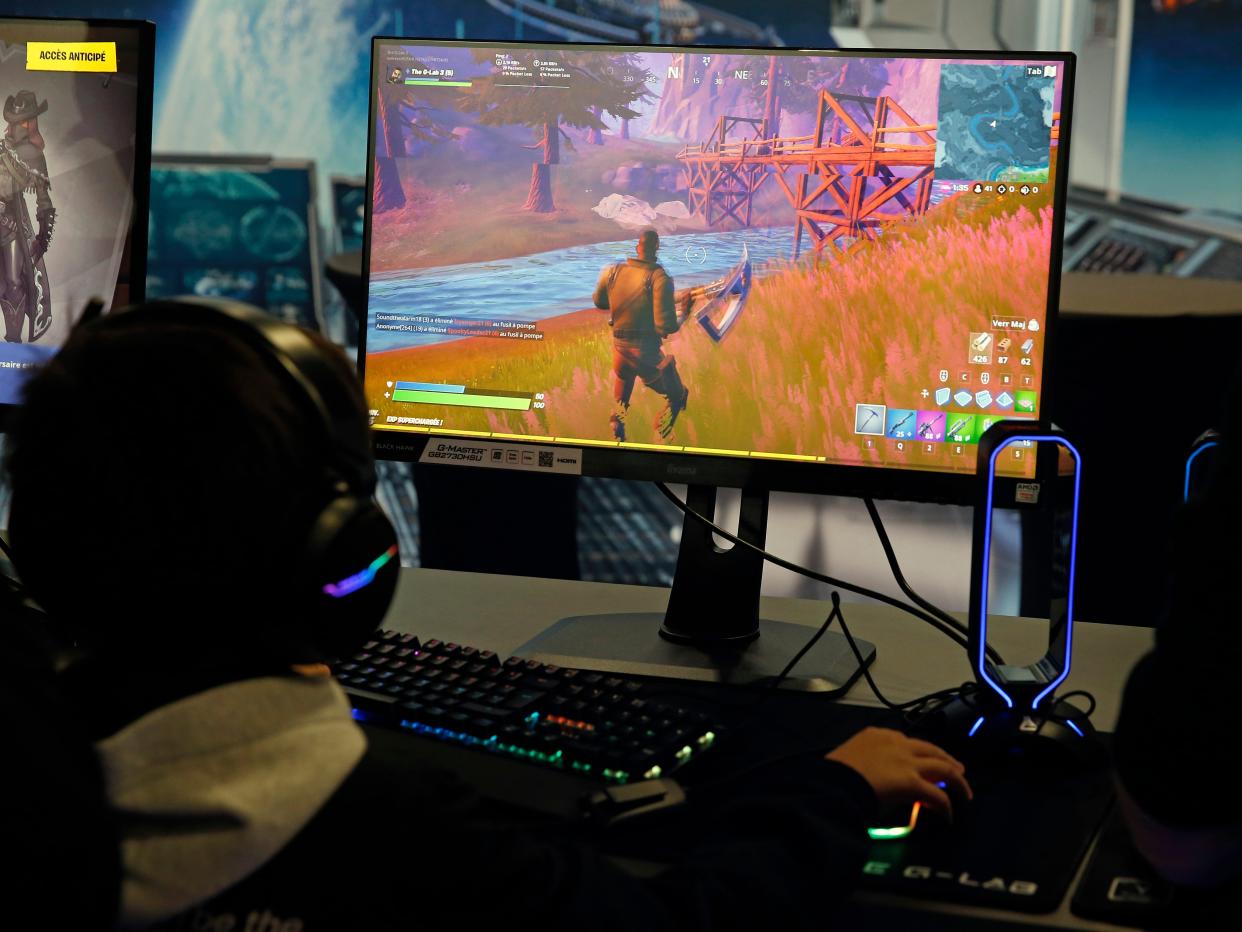 A gamer plays the video game 'Fortnite' developed by Epic Games during the 'Paris Games Week' on October 29, 2019 in Paris, France.