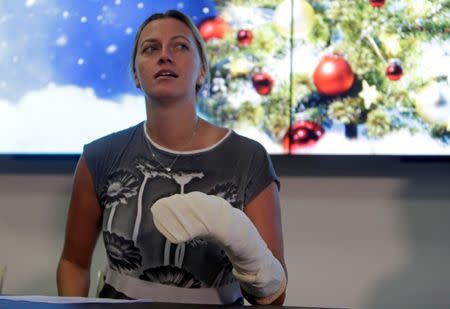 Czech Republic's tennis player Petra Kvitova speaks during a news conference, after she was injured on Tuesday when she fought off an intruder in her home, damaging all the fingers on her playing hand, in Prague, Czech Republic December 23, 2016. REUTERS/David W Cerny