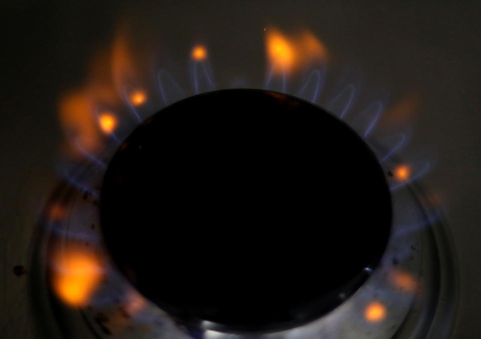 Energy Flames come out of a domestic gas ring on a stove in Manchester, Britain, September 18, 2021. REUTERS/Phil Noble