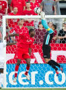 Olivier Occean of Canada (L) and Honduras' goal keeper Noel Valladares jump for the ball during their FIFA 2014 World Cup Qualifier at BMO field in Toronto, Ontario, June 12, 2012. The match ended in a 0-0 tie. AFP PHOTO / Geoff RobinsGEOFF ROBINS/AFP/GettyImages